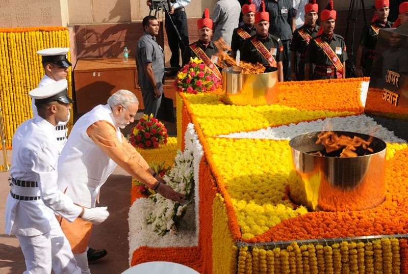 The Prime Minister, Shri Narendra Modi laying wreath at Amar Jawan Jyoti, India Gate,..