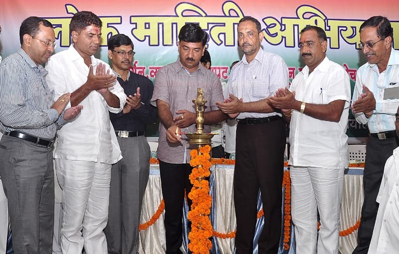 Shri Umnesh Patil, MLA, Chalisgaon, lighting the lamp to inaugurate the Public Information Campaign..