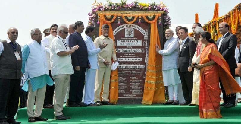 The Prime Minister, Shri Narendra Modi unveiling the plaque to lay the foundation stone ..
