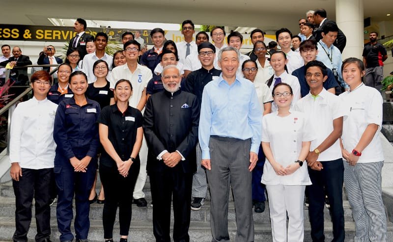 The Prime Minister, Shri Narendra Modi in a group photograph at the Institute of..