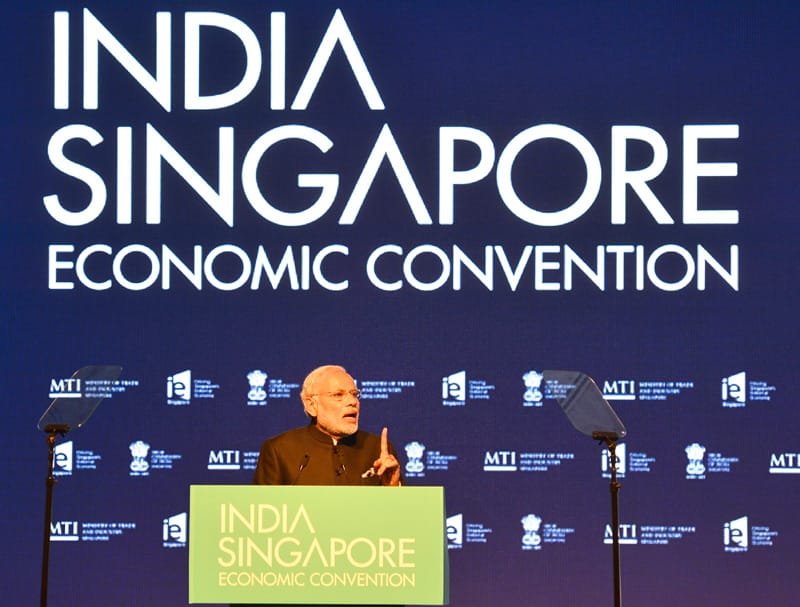The Prime Minister, Shri Narendra Modi addressing at the India-Singapore Economic Convention,..
