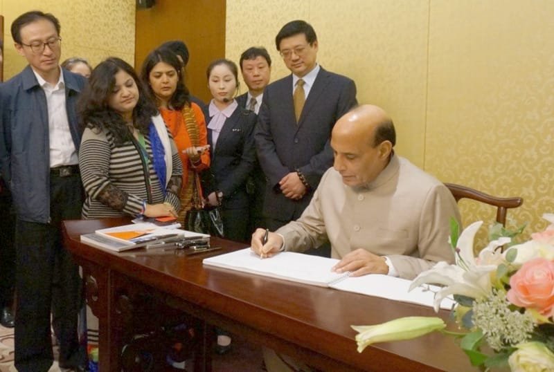 The Union Home Minister, Shri Rajnath Singh signing the visitors’ book during his..