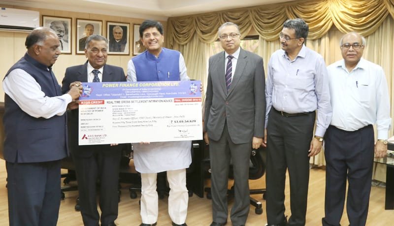 The CMD, Power Finance Corporation (PFC), Shri M.K. Goyal presenting a dividend..