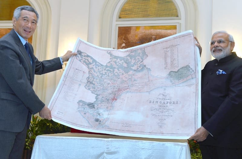 The Prime Minister, Shri Narendra Modi presenting a reproduction of a map of ..