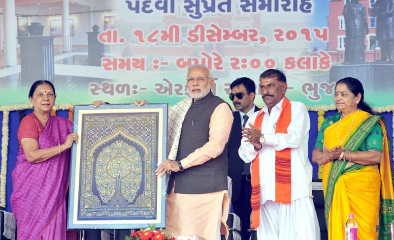 The Prime Minister, Shri Narendra Modi being presented a memento by the..