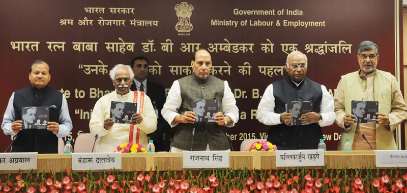 The Union Home Minister, Shri Rajnath Singh releasing a booklet on Dr. B.R. Ambedkar to..