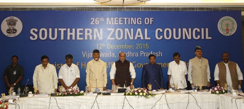 The Union Home Minister, Shri Rajnath Singh, the Chief Minister of Andhra Pradesh, Shri N. Chandrababu Naidu and other dignitaries observing two-minute silence for the victims of flash floods in Chennai, at the 26th Southern Zonal Council meeting, in Vijayawada, Andhra Pradesh