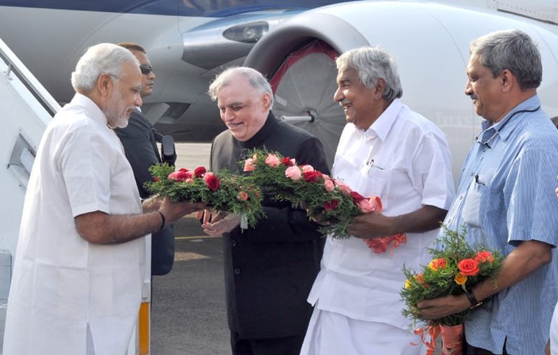 The Prime Minister, Shri Narendra Modi being received by the Governor of Kerala, ..