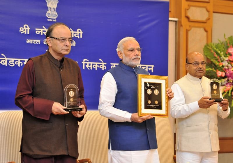 The Prime Minister, Shri Narendra Modi releasing the commemorative coins on..