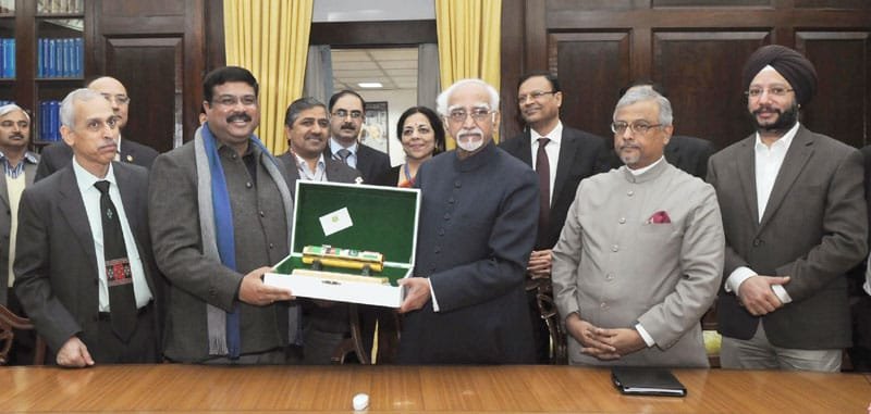The Vice President, Shri Mohd. Hamid Ansari handing over to the Minister of State for..