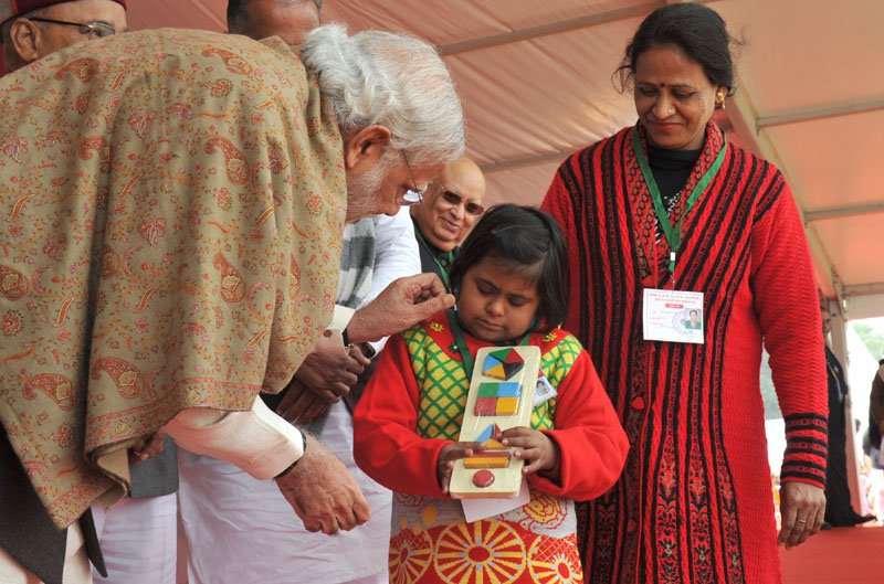The Prime Minister, Shri Narendra Modi interacting with ‘Divyang’ children during ..