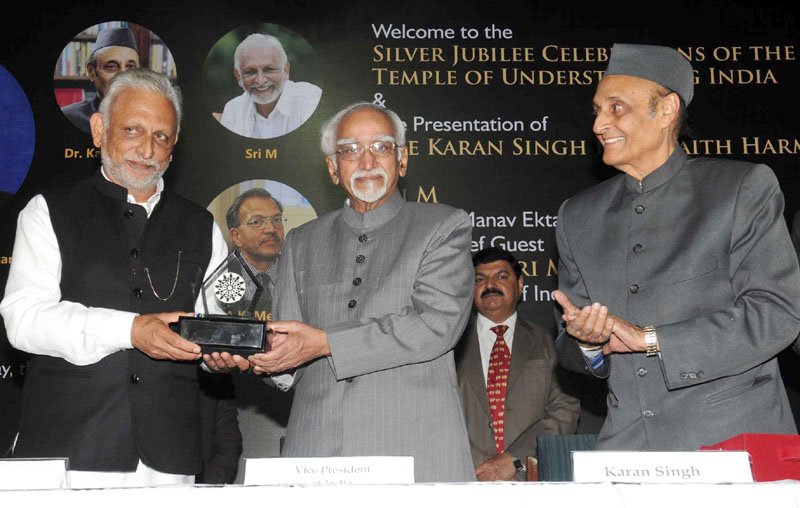 The Vice President, Shri M. Hamid Ansari giving away Dr. Karan Singh Interfaith Harmony ..