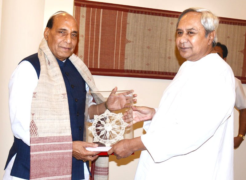 The Chief Minister of Odisha, Shri Naveen Patnaik presenting the memento to ..