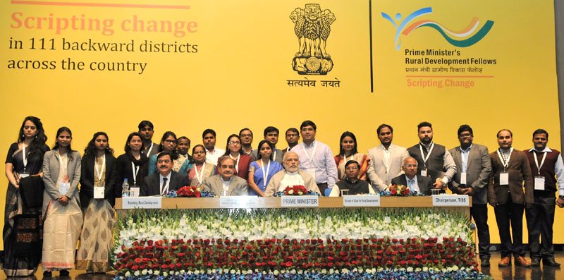 The Prime Minister, Shri Narendra Modi in a group photograph with the youth who have been working in…