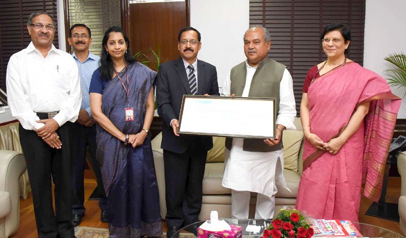The Chairman-cum-Managing Director of MOIL, Shri G.P. Kundargi presenting a ..