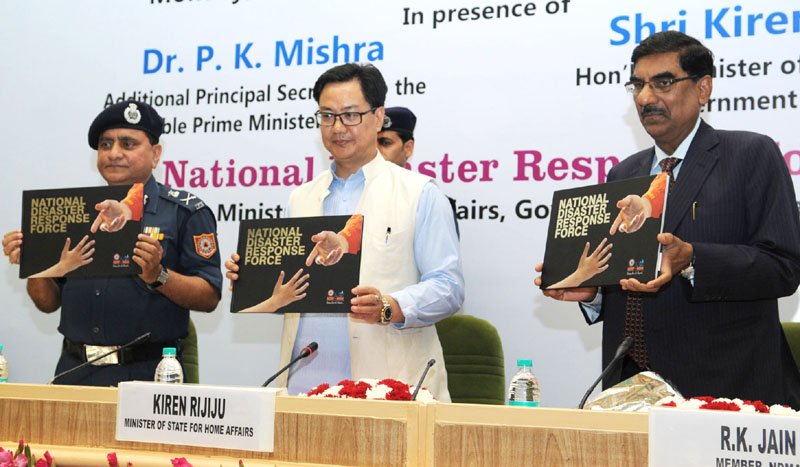 The Minister of State for Home Affairs, Shri Kiren Rijiju releasing the NDRF coffee table book ..