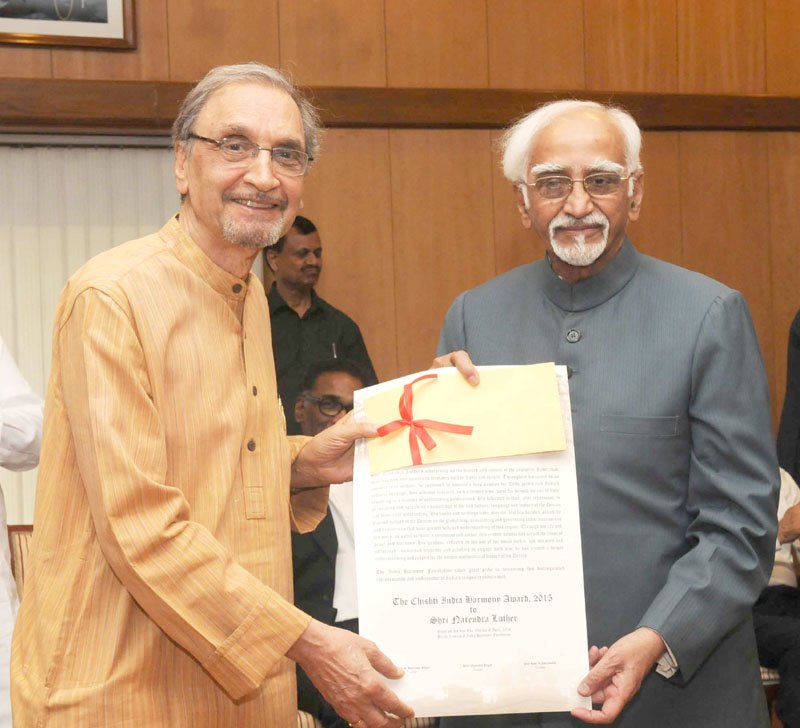 The Vice President, Shri M. Hamid Ansari giving away the Chisti India Harmony Award ..