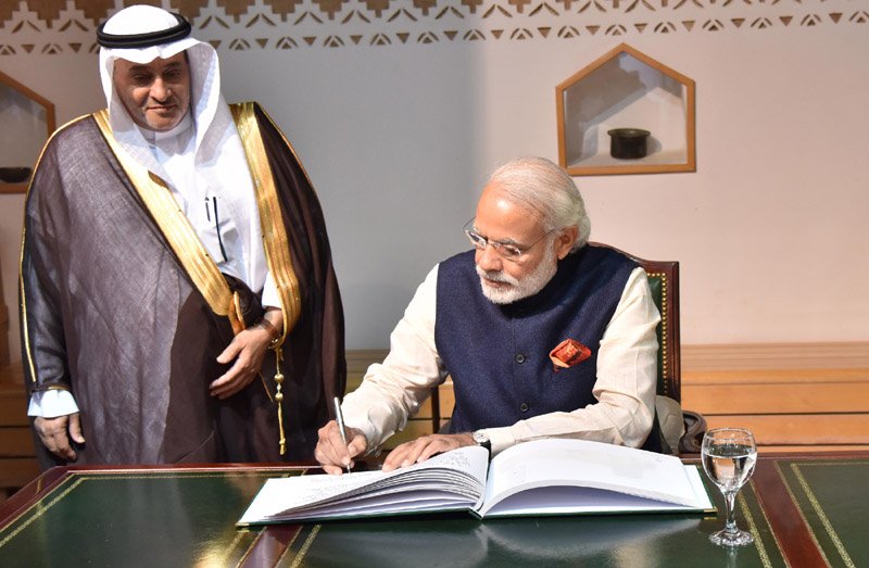 The Prime Minister, Shri Narendra Modi signing the visitors’ book, during his visit..