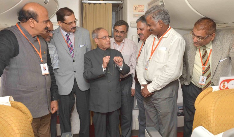 The President, Shri Pranab Mukherjee interacting with the accompanying officials, ..