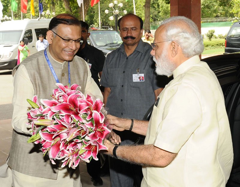 The Prime Minister, Shri Narendra Modi being welcomed by the Minister of State..
