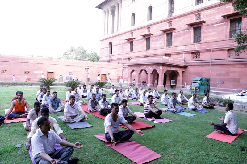 Officials participating in a Yoga workshop organised by the Ministry of Home Affairs, at North Block, in New Delhi