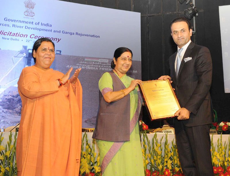 The Union Minister for External Affairs, Smt. Sushma Swaraj felicitating the officials of..
