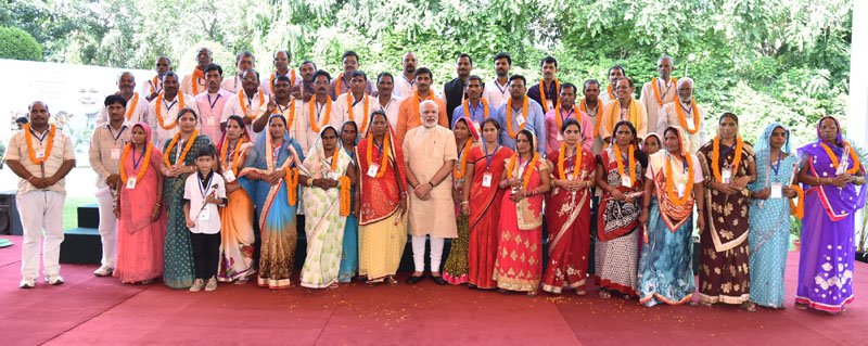 The Prime Minister, Shri Narendra Modi with the Village Pradhans from Varanasi Parliamentary Constituency, in New Delhi
