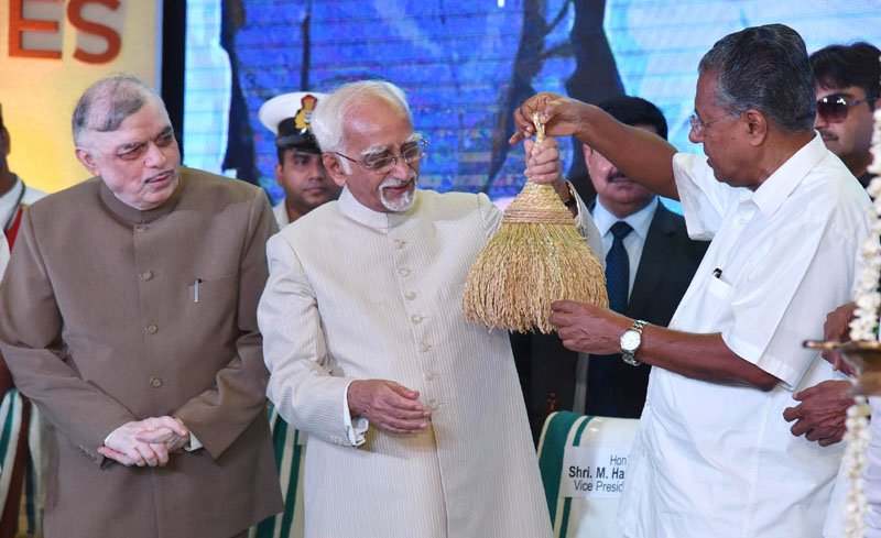 The Vice President, Shri M. Hamid Ansari being presented a memento by..