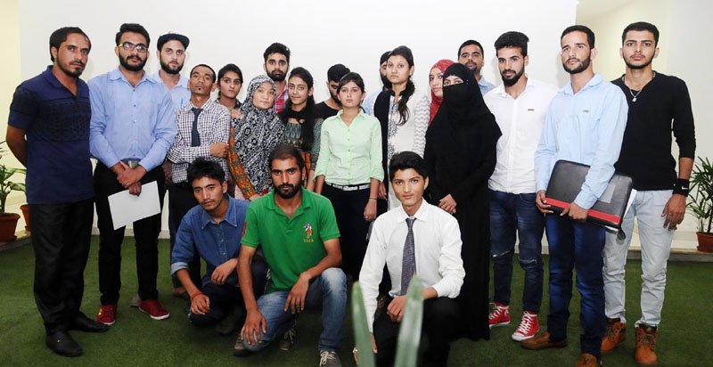 A group of students from Jammu and Kashmir studying in other states, in a group photograph..