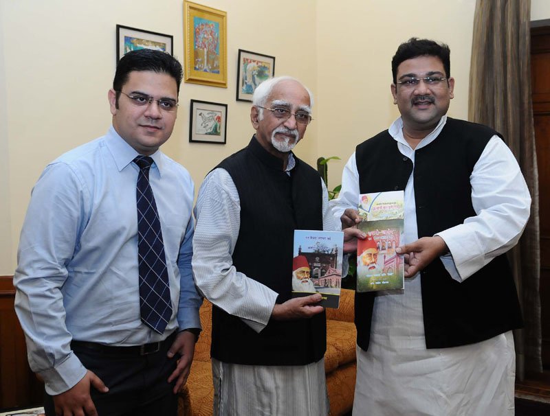 M. Hamid Ansari being presented the book ‘Sir Syed Ahmad Khan