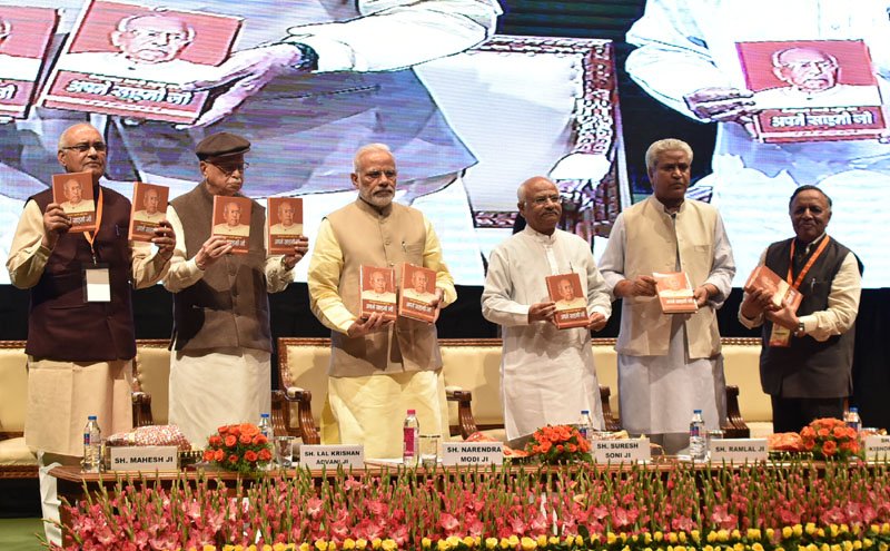 The Prime Minister, Shri Narendra Modi releasing the book on the life of ..
