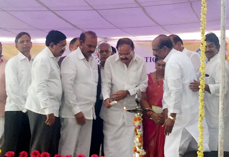 M. Venkaiah Naidu lighting the lamp at the foundation stone laying ceremony for Krishgi Vigynan Kendra