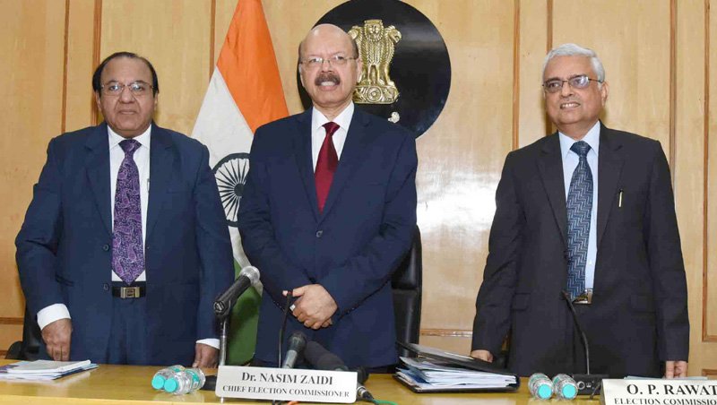 The Chief Election Commissioner, Dr. Nasim Zaidi holding..