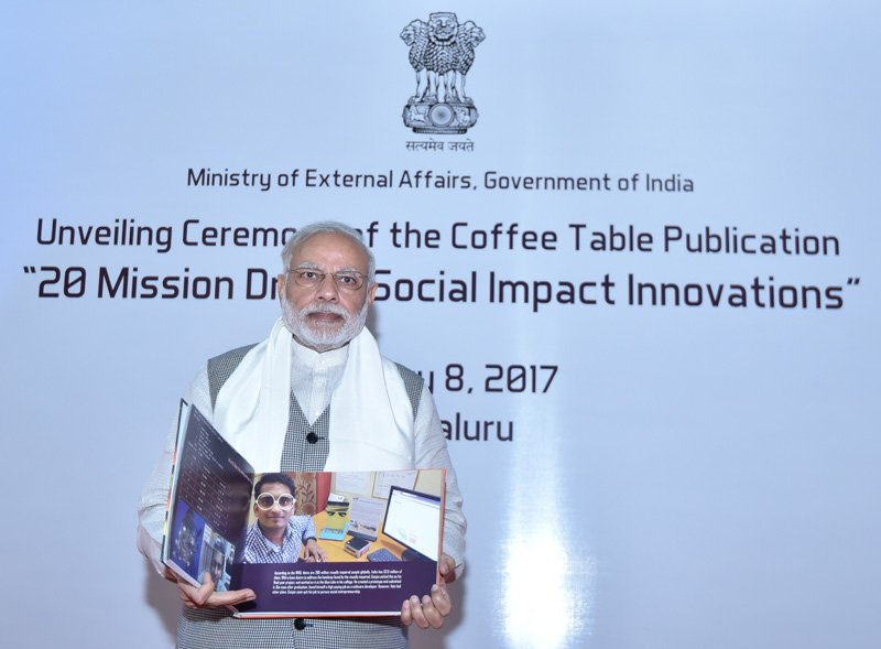 The Prime Minister, Shri Narendra Modi releasing the Coffee Table..