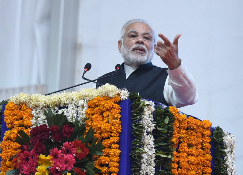 The Prime Minister, Shri Narendra Modi addressing the Public Meeting, ..