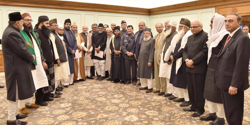 The Prime Minister, Shri Narendra Modi in a group photograph with..
