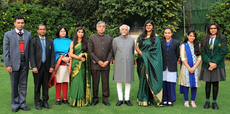The Vice President, Shri M. Hamid Ansari with the winners of Essay Competition..