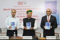 Dr. D. Bhalla, IAS, releasing the book World Economic Crises and India..