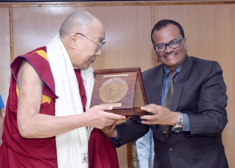 His Holiness the Dalai Lama being presented a memento by the ..