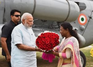 The Prime Minister, Shri Narendra Modi being received by the Governor of Jharkhand, ..