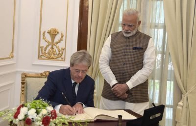 PAOLO GENTILONI ,PM REPUBLIC OF ITALY SIGNS VISITOR BOOK AT HYDERABAD HOUSE