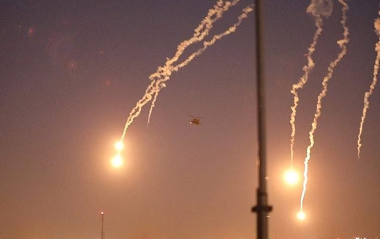 U.s. Army Apache Helicopters Launch Flares As They Conduct Overflights Of The U.s. Embassy In Baghdad
