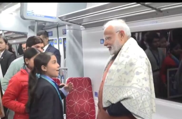 Prime Minister Narendra Modi interacts with students and loco pilots on Namo Bharat train